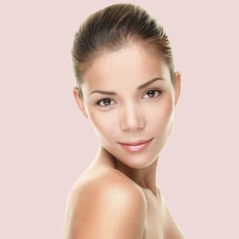 Girl Looking Over Shoulder Pink Background