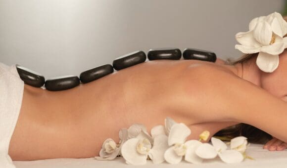 Hot Stone Massage On Woman's Back