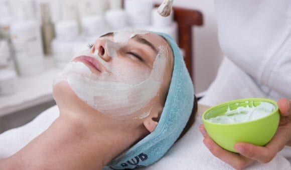 woman having facial spa treatment
